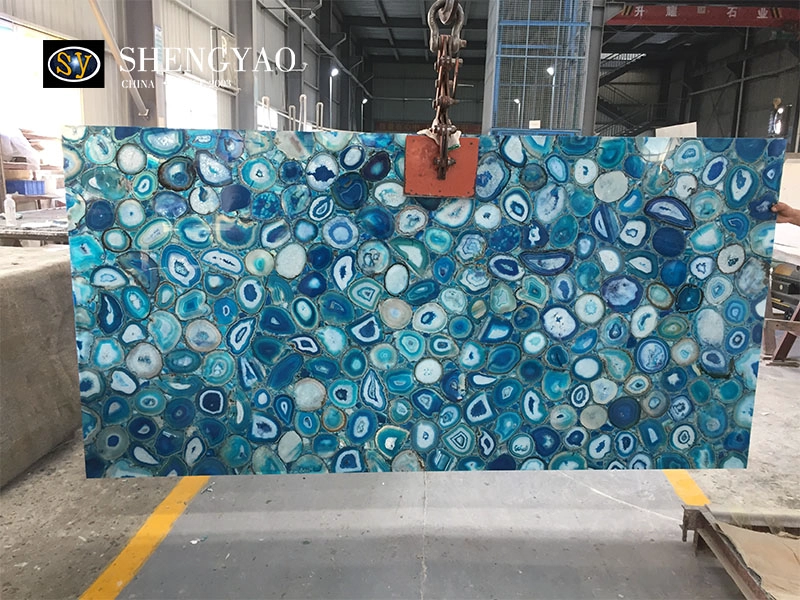 Blue agate gemstone slab displayed in the SYGEMS workshop